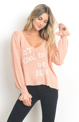 It’s Cool to Be Kind”peach v-neck sweater